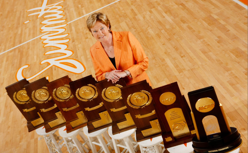 Pat-Summitt-with-8-trophies